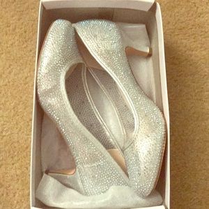 Brand new never been worn silver metallic heels